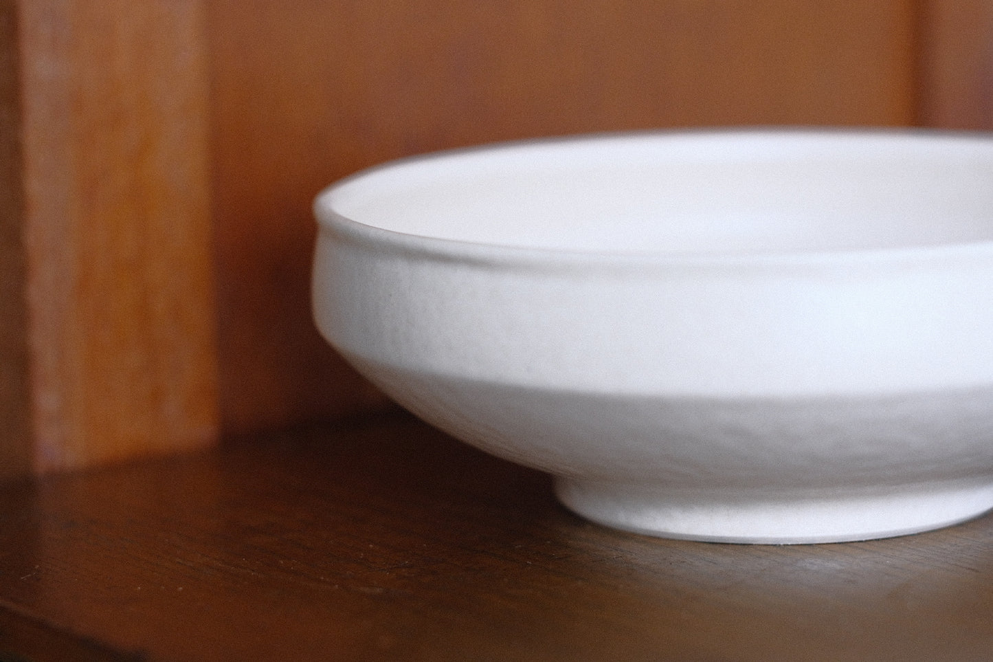 Off-white closed rim shallow bowl